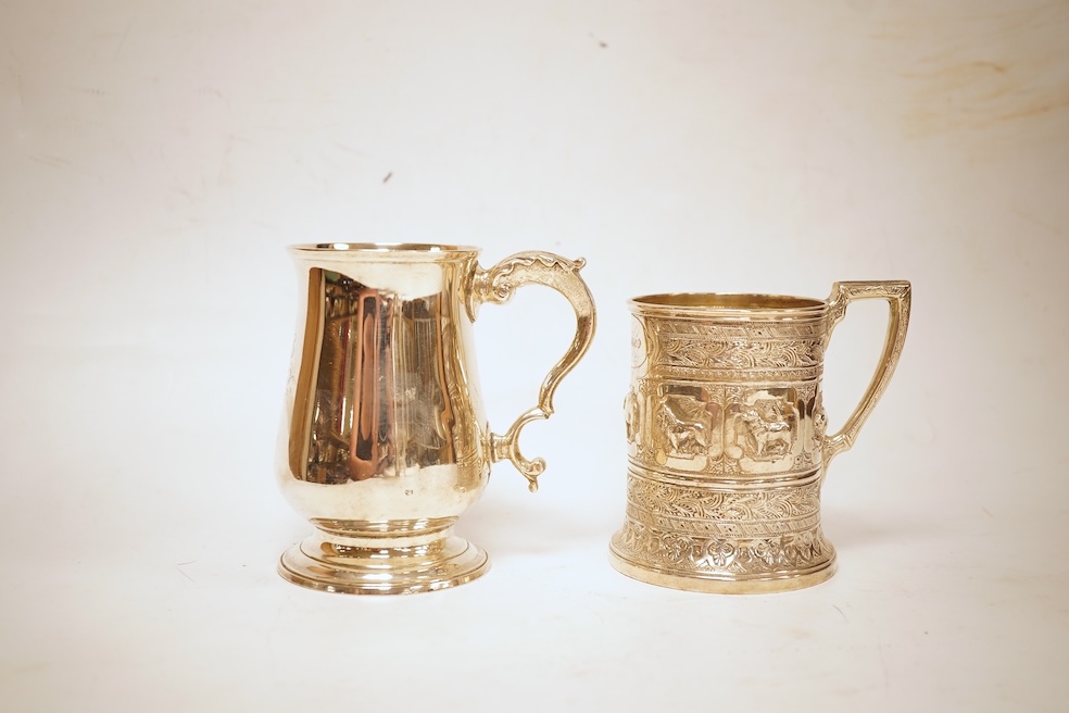 A George III silver baluster mug, Peter & Ann Bateman?, London, 1797, height 10.6cm, together with a late Victorian embossed silver christening mug, Glasgow, 1893, 12.2oz.